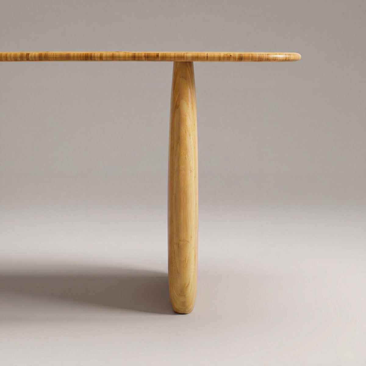Close-up of the leg on the Greenington Aria Dining Table (72") in Wheat bamboo