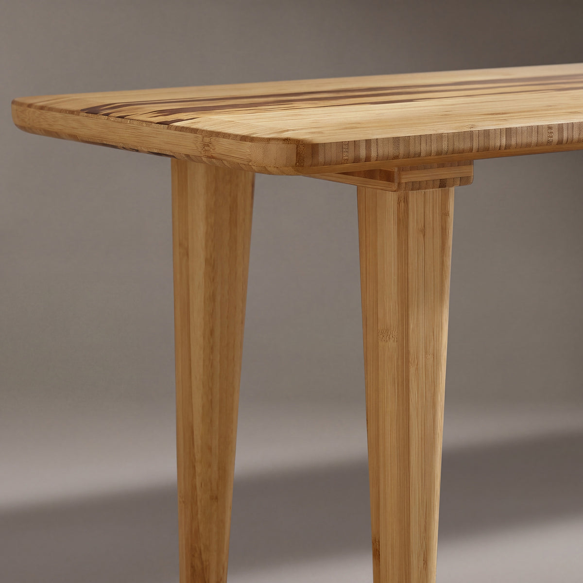 Close-up of the leg on the Greenington Azara Bench in Caramelized bamboo