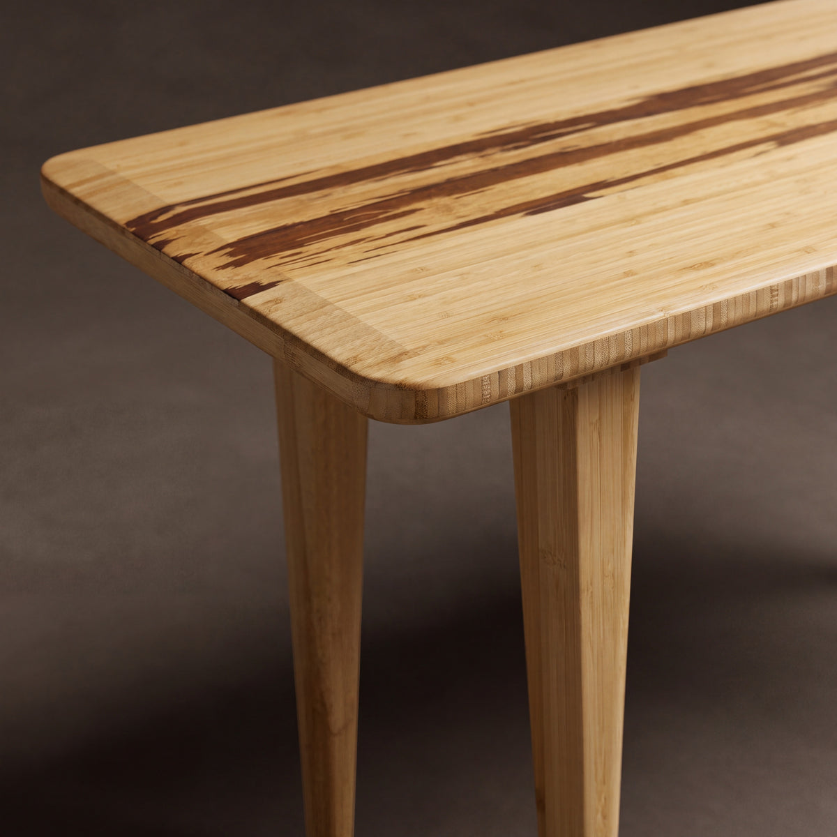 Close-up of the top and bamboo grain on the Greenington Azara Bench in Caramelized bamboo