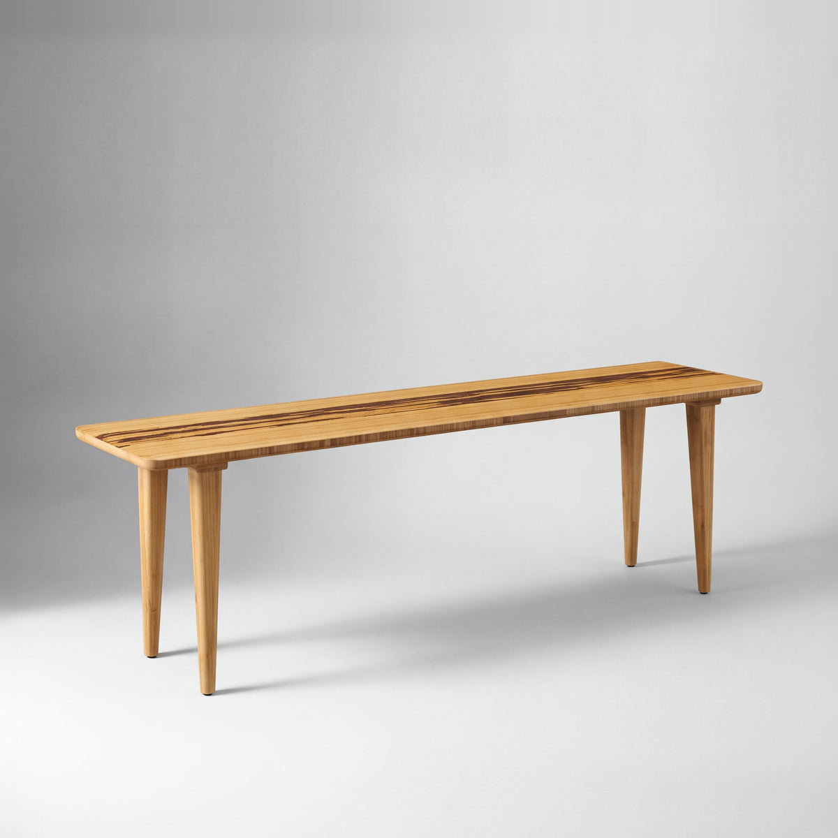 Greenington Azara Bench in Caramelized bamboo, on a studio background
