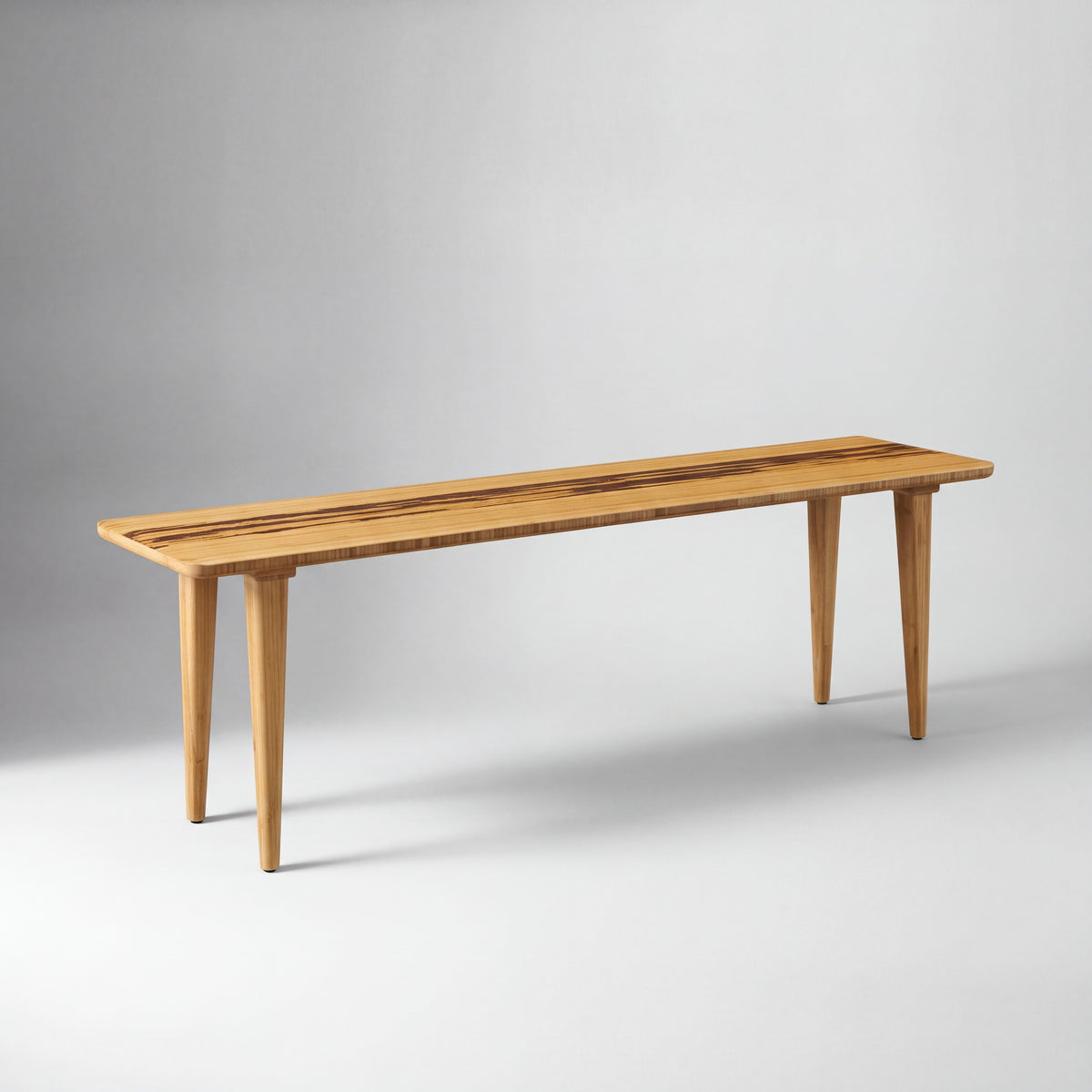 Greenington Azara Bench in Caramelized bamboo, on a studio background