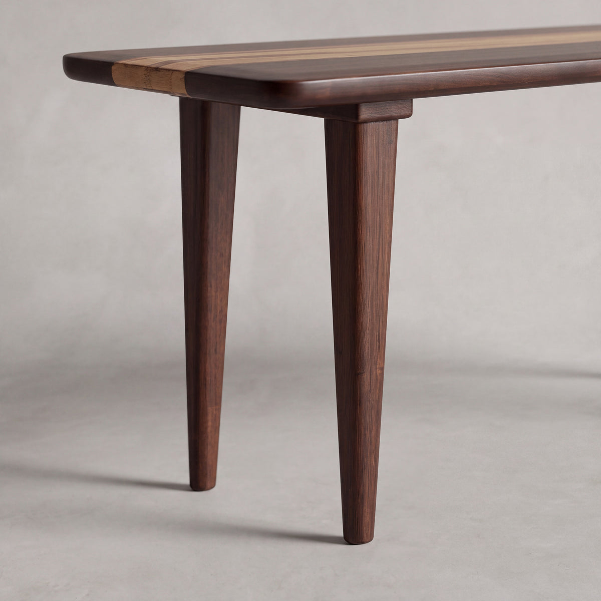Close-up of the leg on the Greenington Azara Bench in Sable bamboo