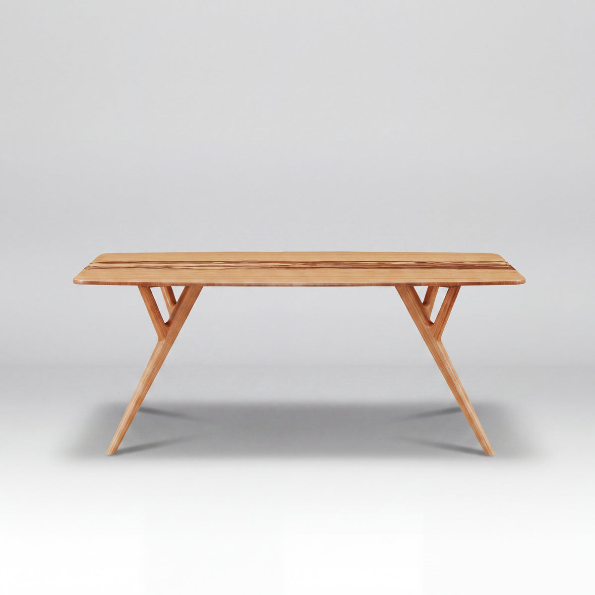 Greenington Azara Dining Table in Caramelized bamboo, on a studio background