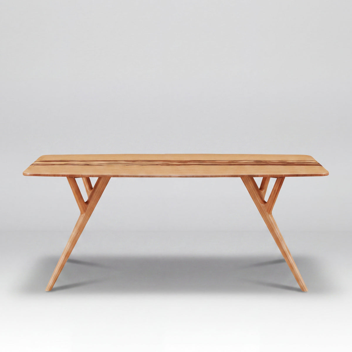 Greenington Azara Dining Table in Caramelized bamboo, on a studio background