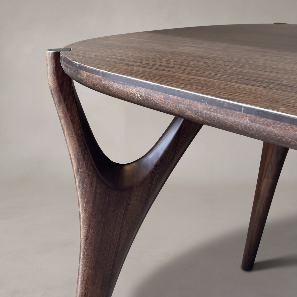 Detail of the leg on the Greenington Belle Dining Table in Black Walnut bamboo