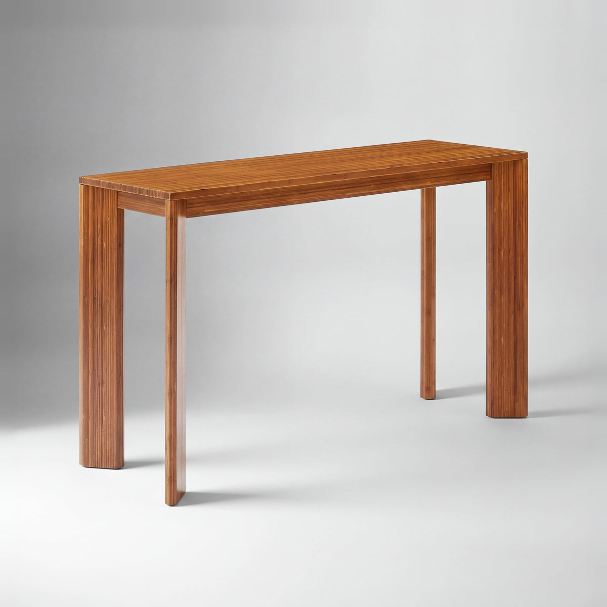 Greenington Brix Counter Table in Amber bamboo, on a studio background