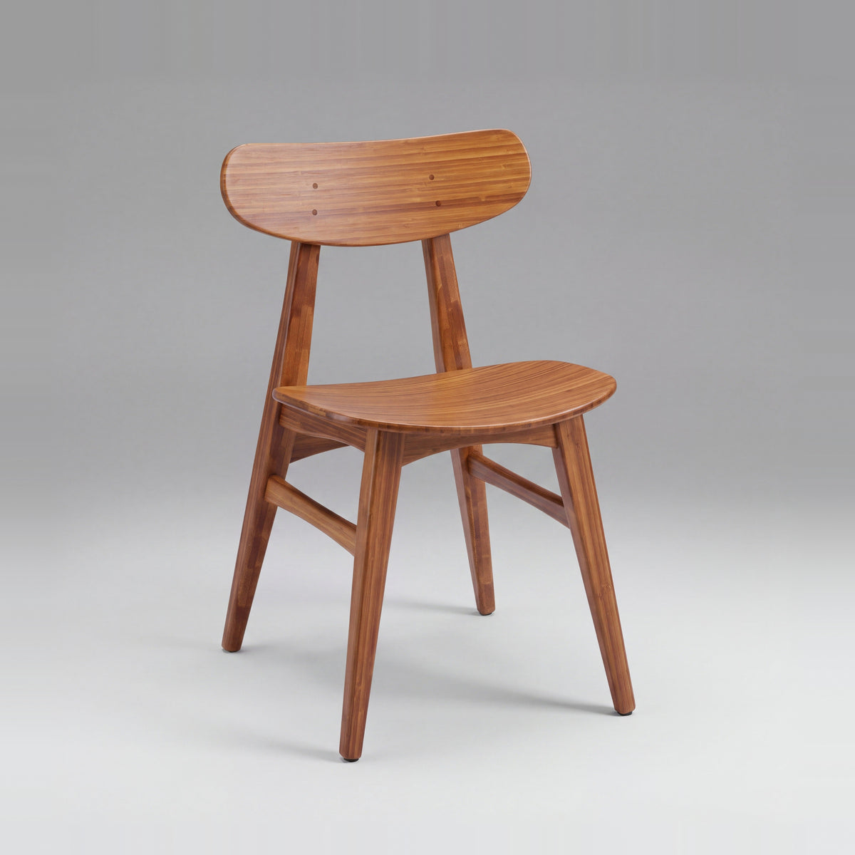 Greenington Cassia Dining Chair in Amber bamboo, on a studio background