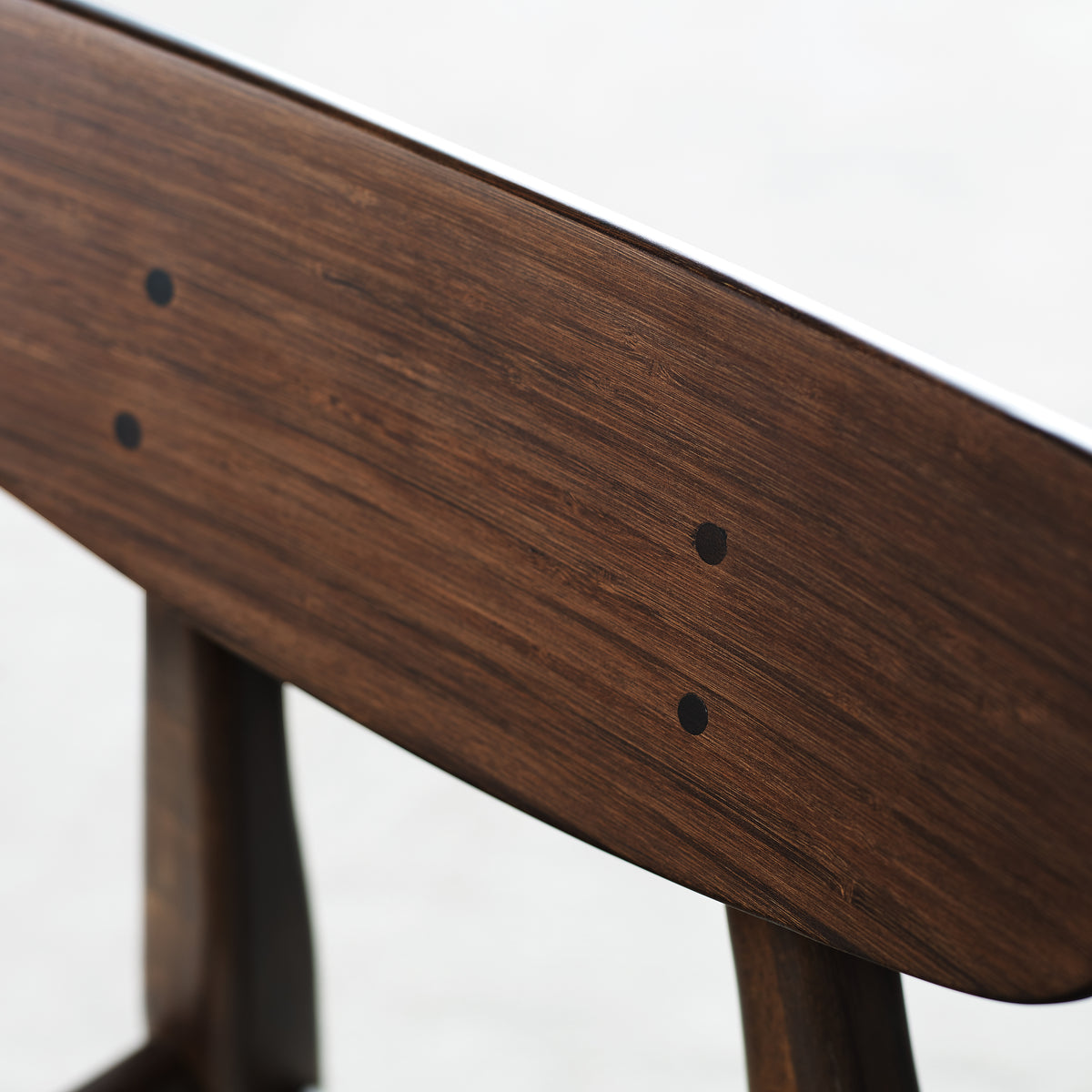 Close-up of the edge profile on the Greenington Cassia Dining Chair in Black Walnut bamboo