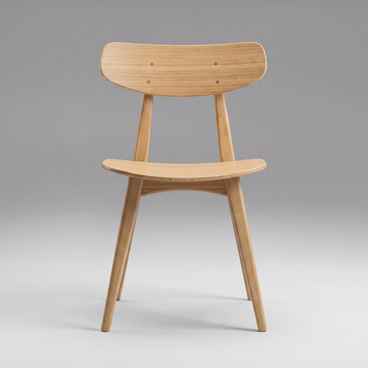 Greenington Cassia Dining Chair in Caramelized bamboo, on a grey studio background, front view