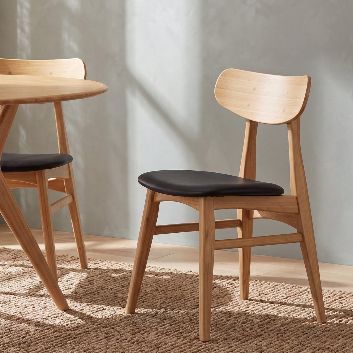 Greenington Cassia Dining Chair in Caramelized bamboo with a Black leather seat, styled in a dining room