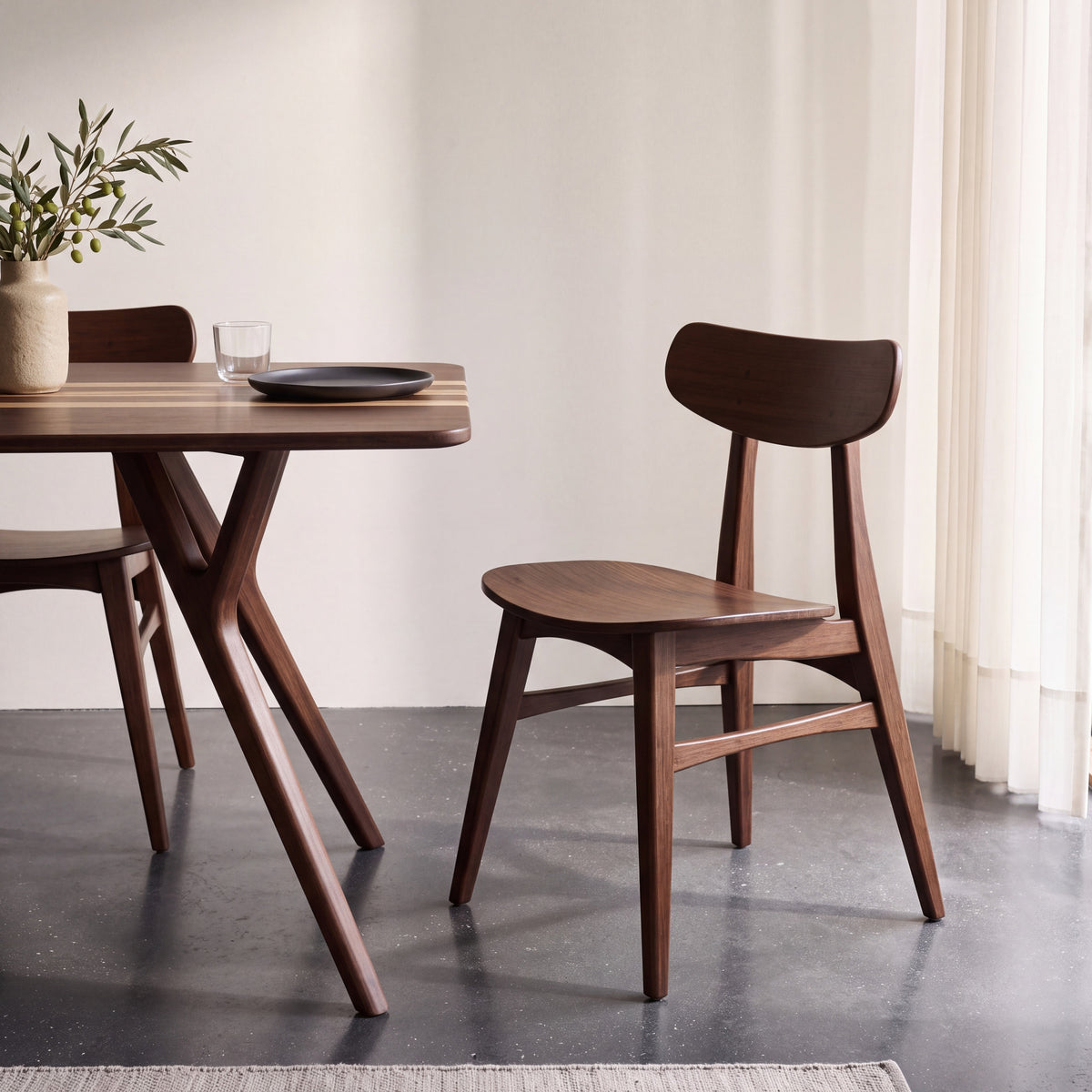 Greenington Cassia Dining Chair in Sable bamboo, styled in a dining room