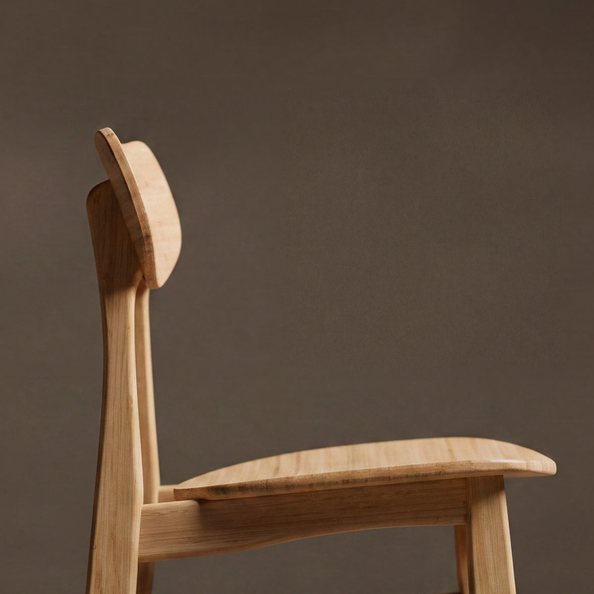Close-up of the seat on the Greenington Cassia Dining Chair in Wheat bamboo