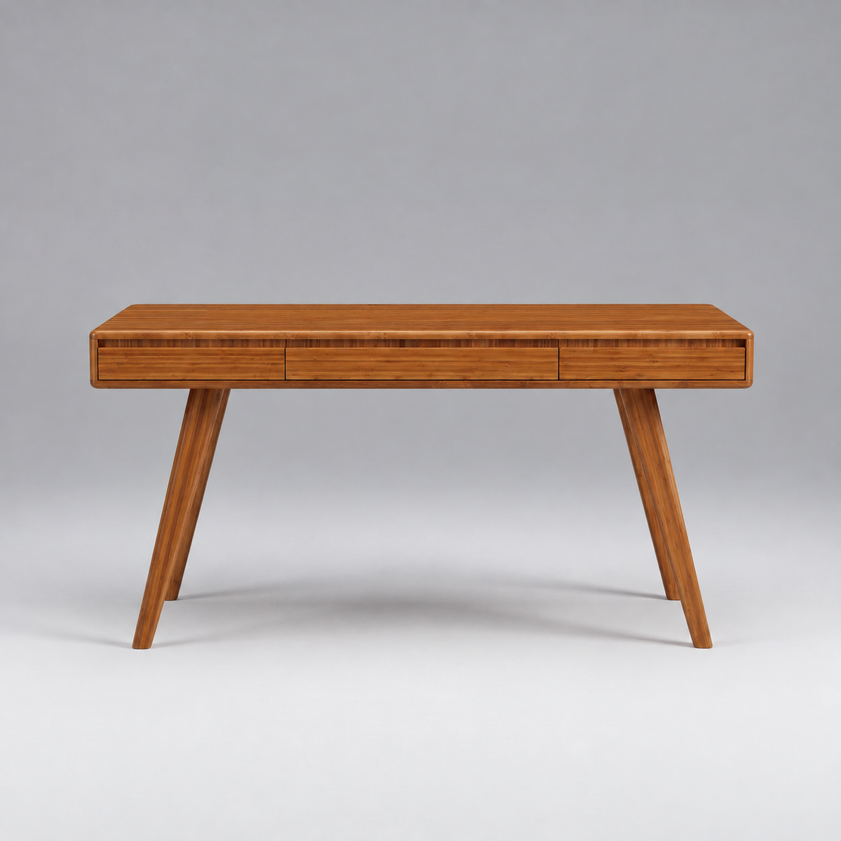 Greenington Currant Writing Desk in Amber bamboo, shown on a plain background
