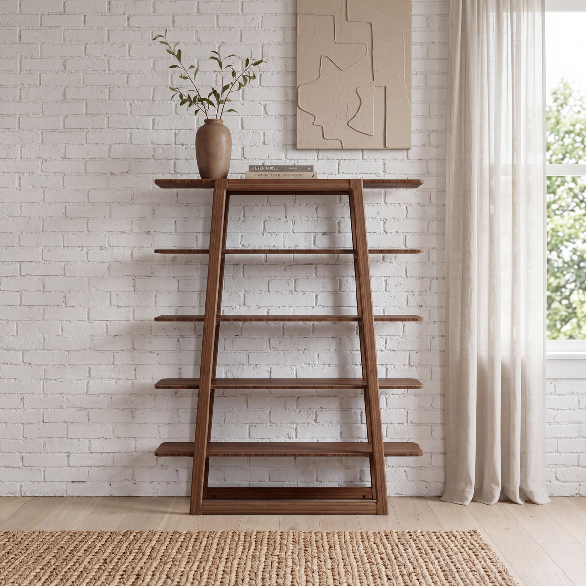 Greenington Currant Bookshelf in Black Walnut bamboo, styled in a living room