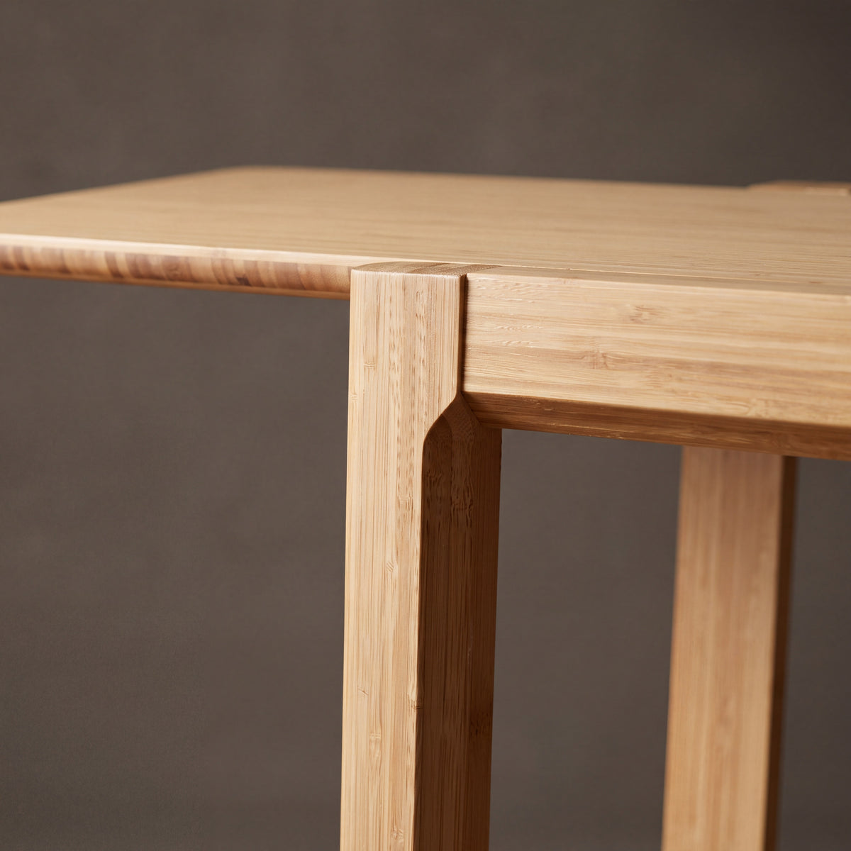 Close-up of the corner joinery on the Greenington Currant Bookshelf in Caramelized bamboo
