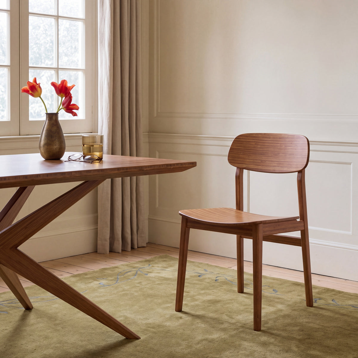 Greenington Currant Chair in Amber bamboo, styled in a dining room
