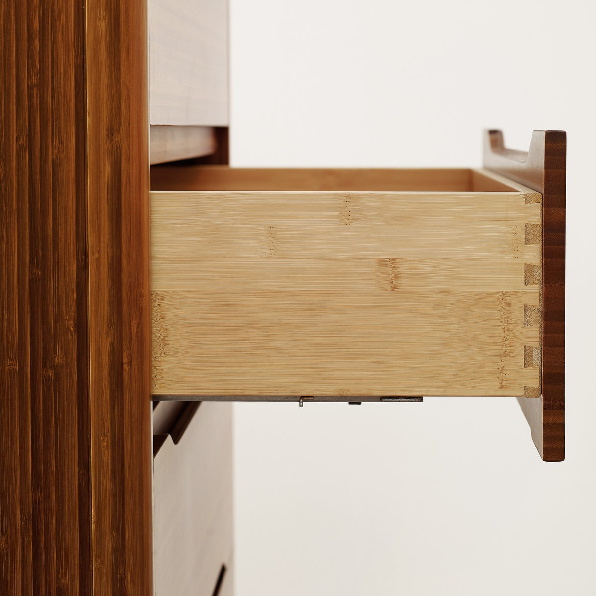 Close-up of the drawer joinery on the Greenington Currant Chest in Amber bamboo