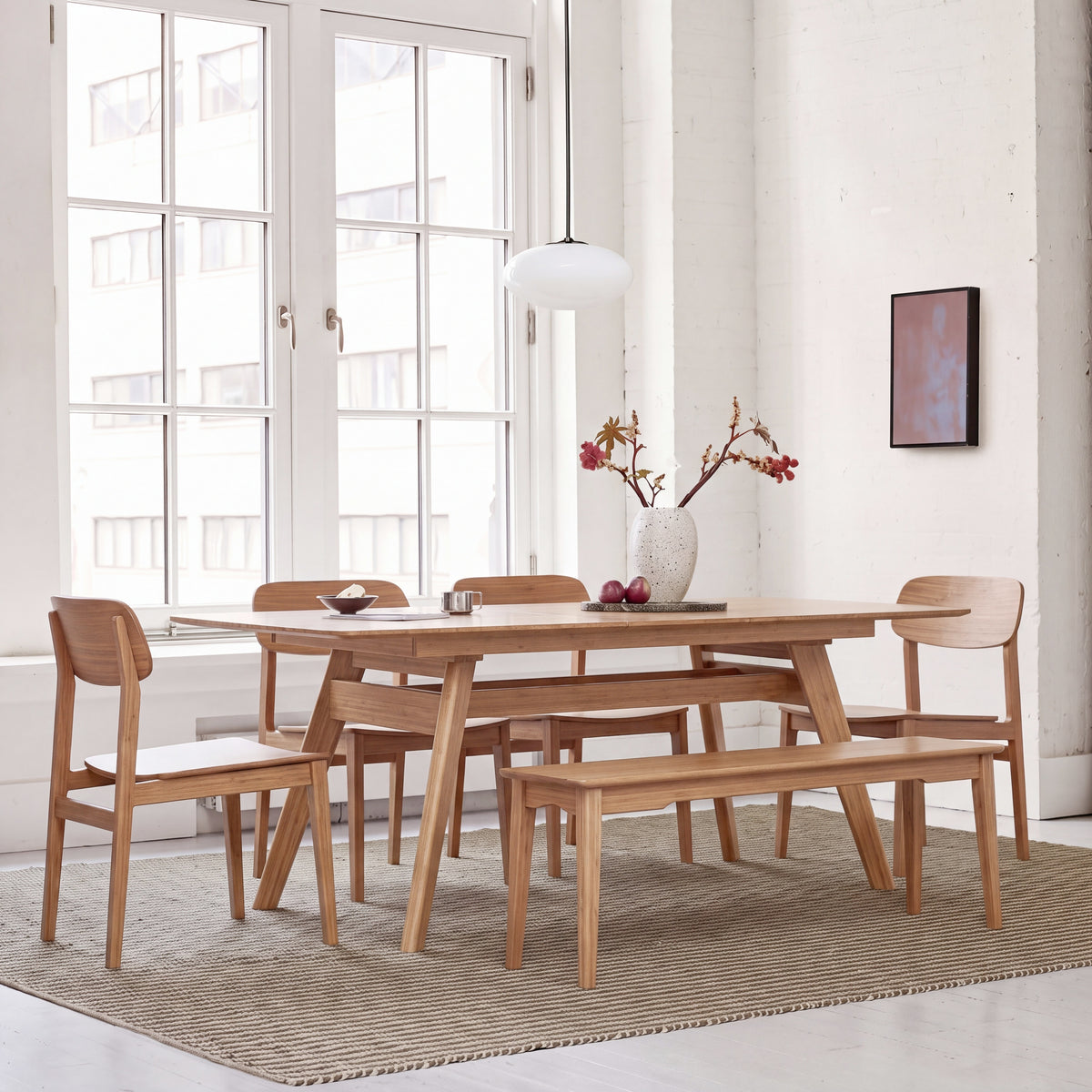 Greenington Currant Dining Table in Caramelized bamboo, styled in a dining room