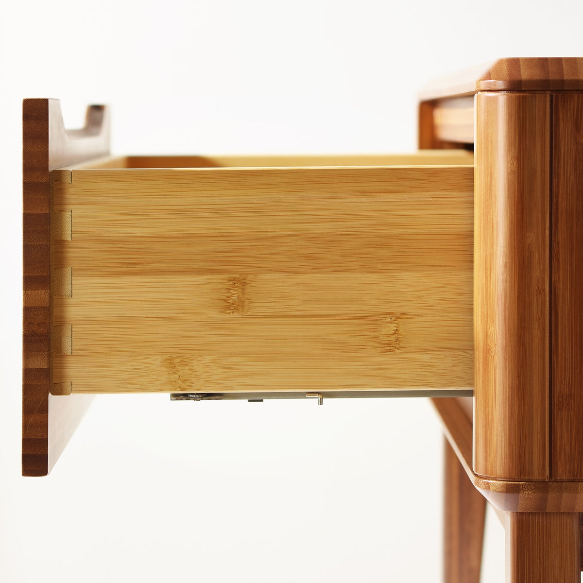 Close-up of the drawer joinery on the Greenington Currant Nightstand in Amber bamboo