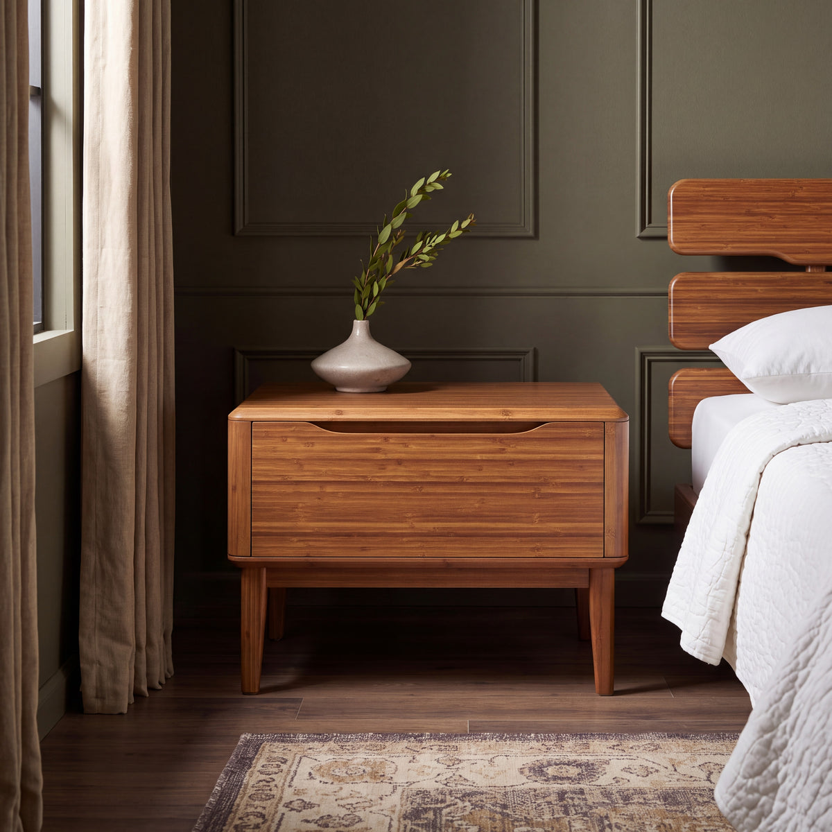 Greenington Currant Nightstand in Amber bamboo, styled in a bedroom