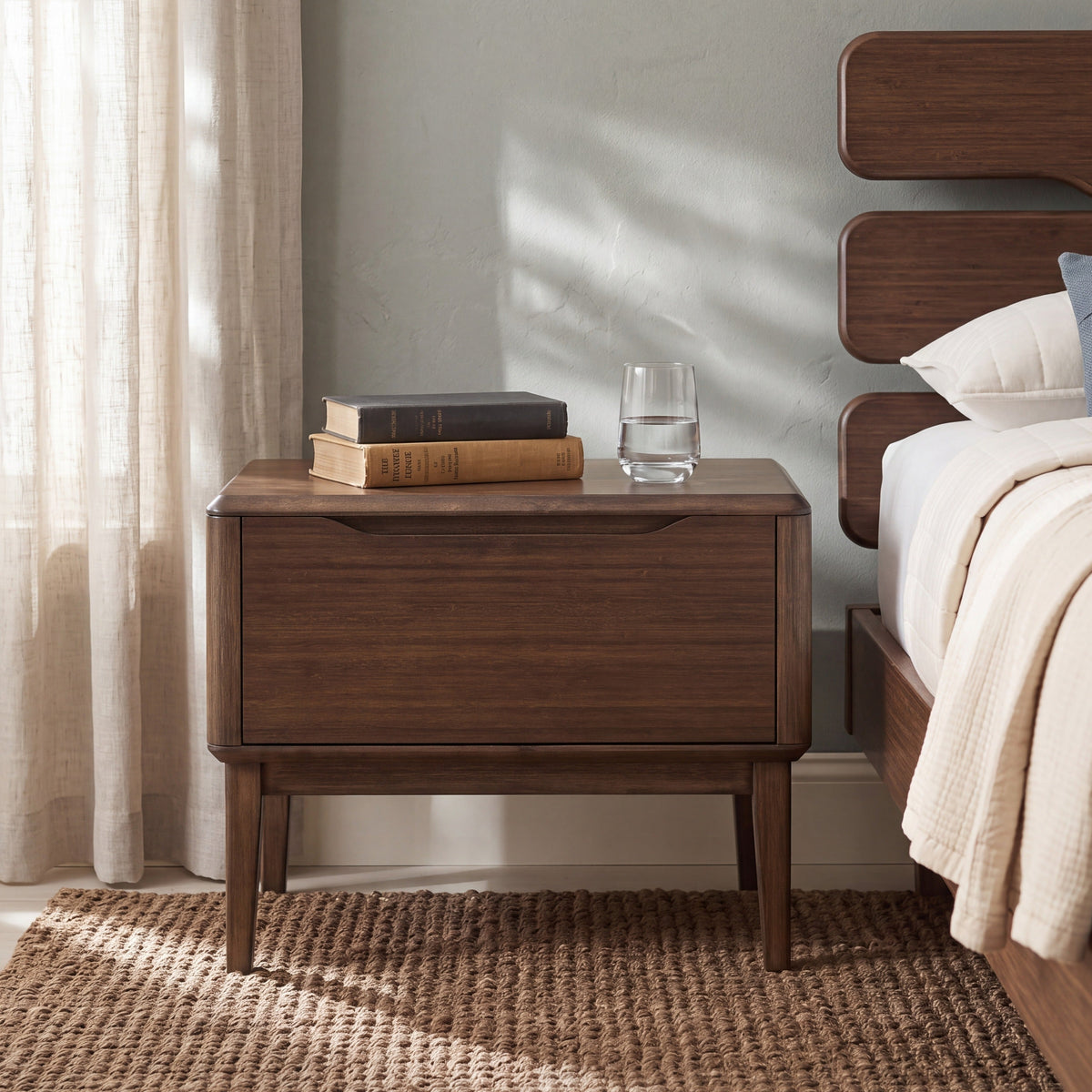 Greenington Currant Nightstand in Black Walnut bamboo, styled in a bedroom