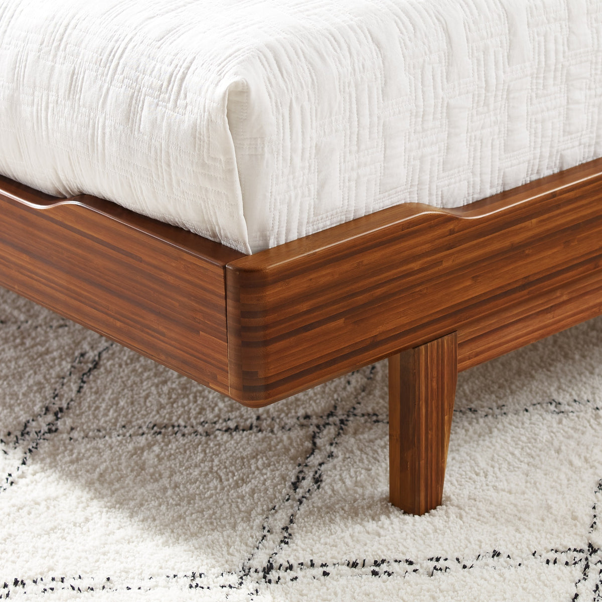 Close-up of the frame on the Greenington Currant Platform Bed in Amber bamboo