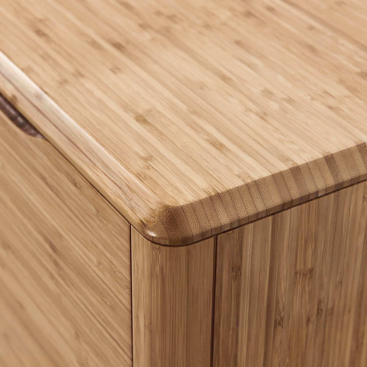 Close-up of the corner joinery on the Greenington Currant Sideboard/Media Center in Caramelized bamboo
