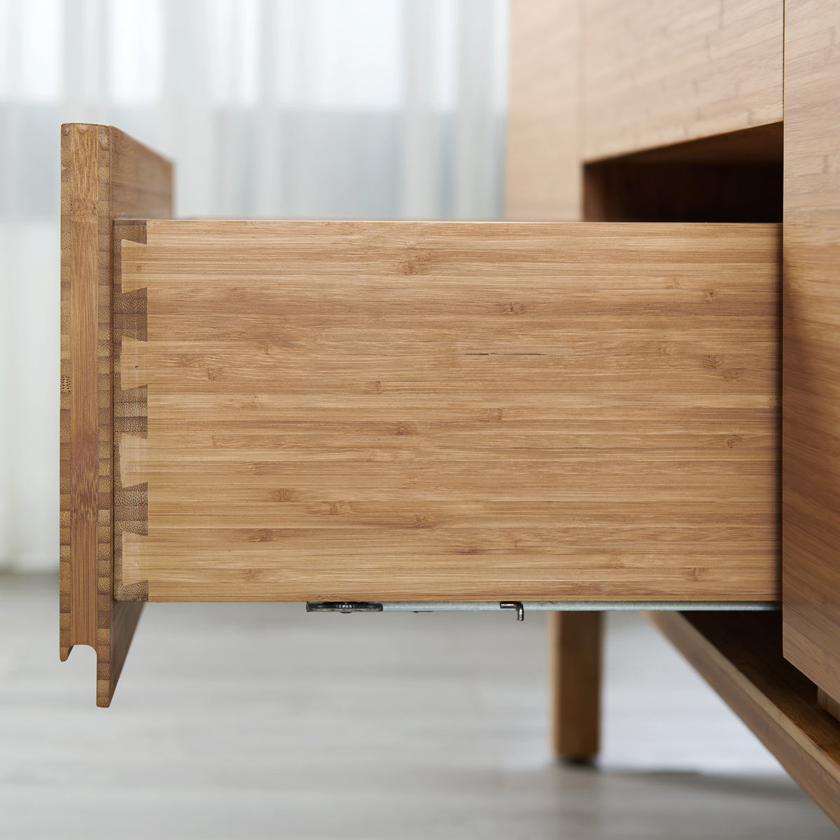 Close-up of the drawer joinery on the Greenington Currant Sideboard/Media Center in Caramelized bamboo