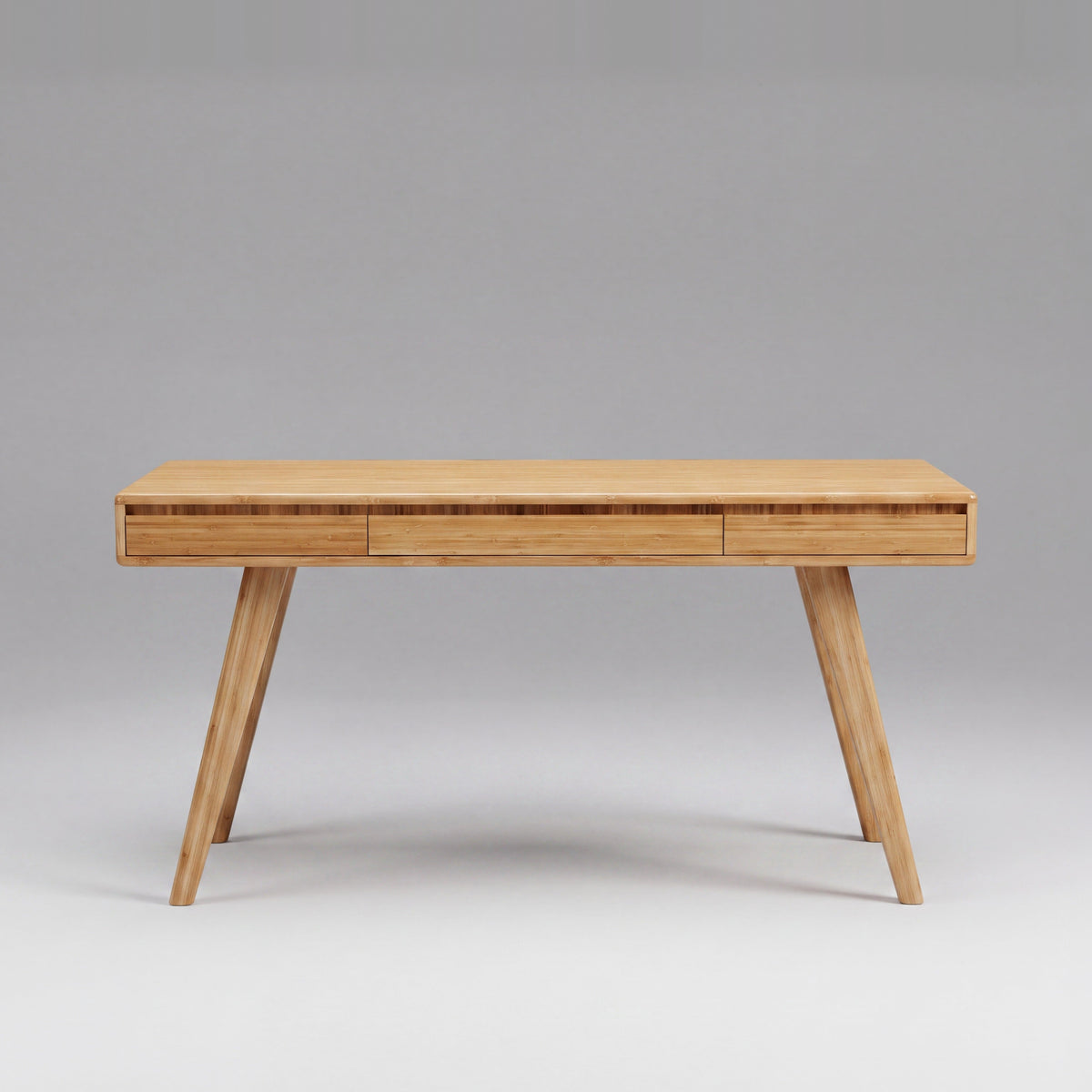 Greenington Currant Writing Desk in Caramelized bamboo, on a studio background