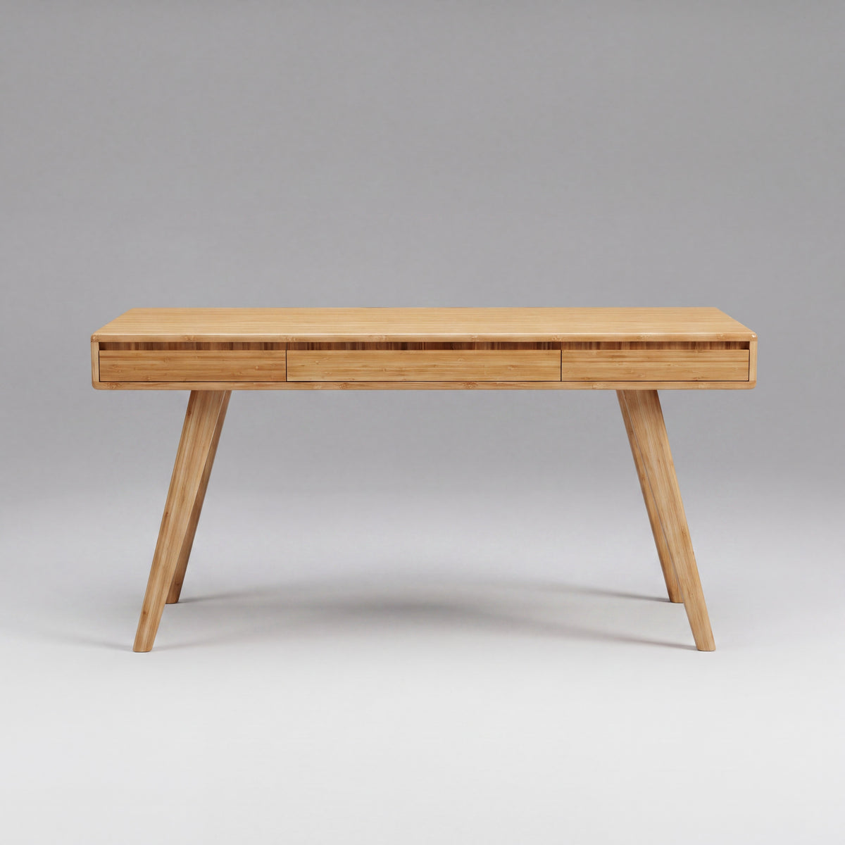 Greenington Currant Writing Desk in Caramelized bamboo, on a studio background