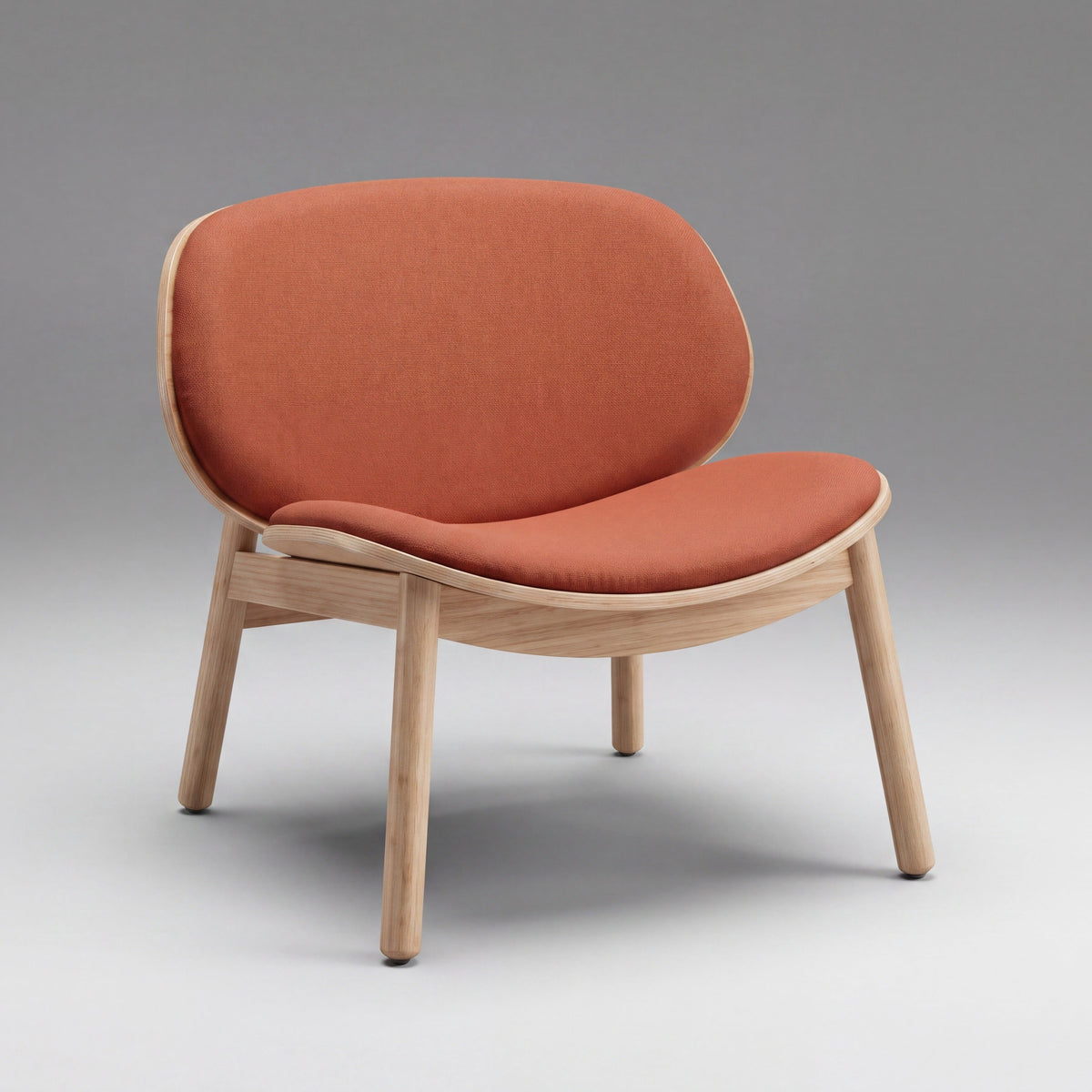 Greenington Danica Chair in Red fabric with a Wheat bamboo frame, on a studio background