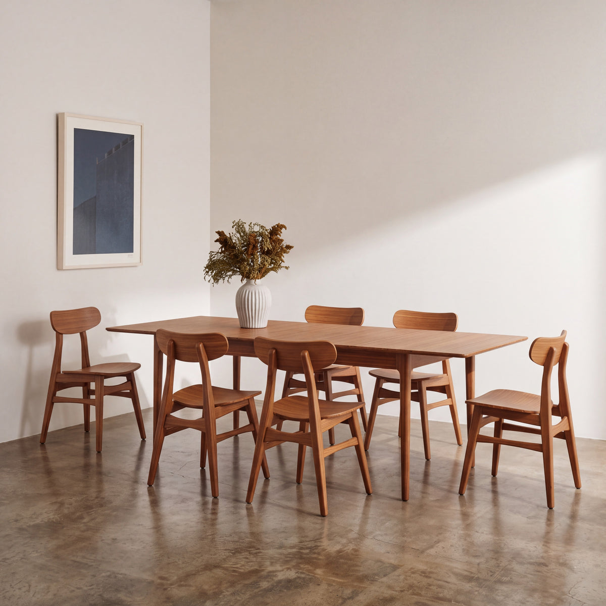 Greenington Erikka Dining Table in Amber bamboo, shown in a dining room