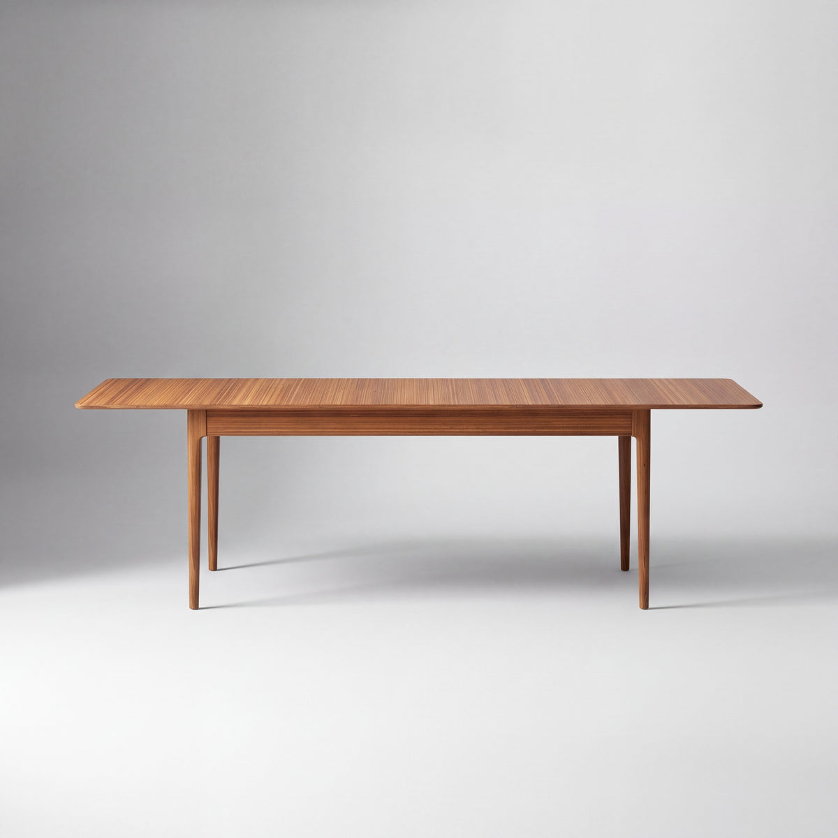 Greenington Erikka Dining Table in Amber bamboo, shown on a plain background