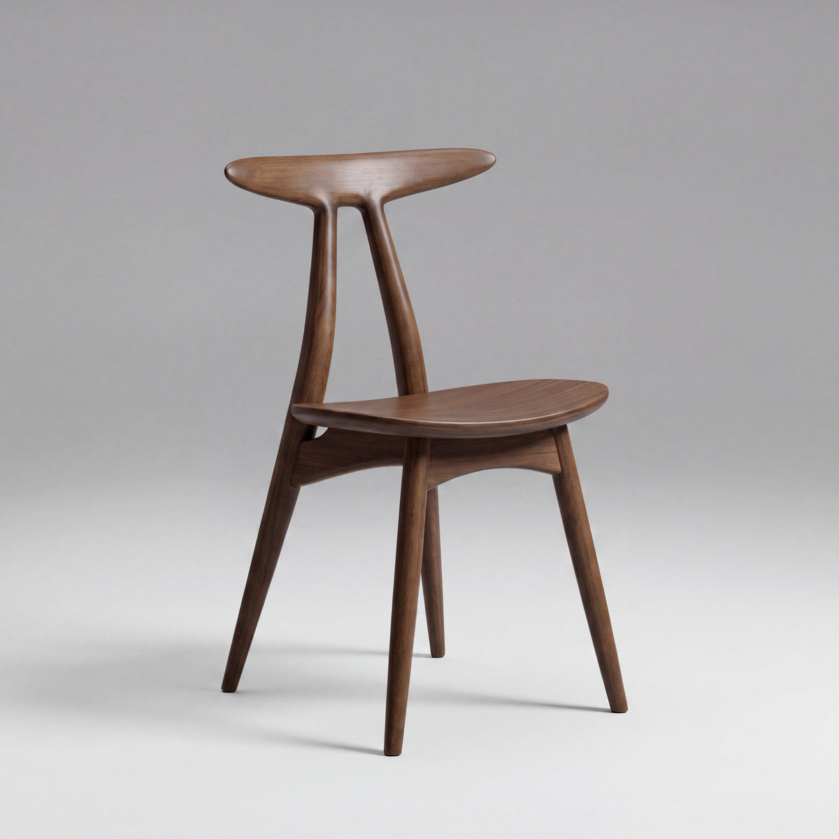 Skagen open-back sculptural chair in Black Walnut