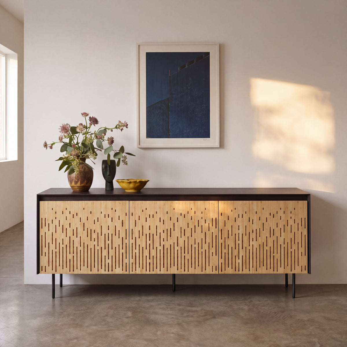 Greenington Hanna Console Caviar in Caviar and Wheat bamboo, styled in a living room