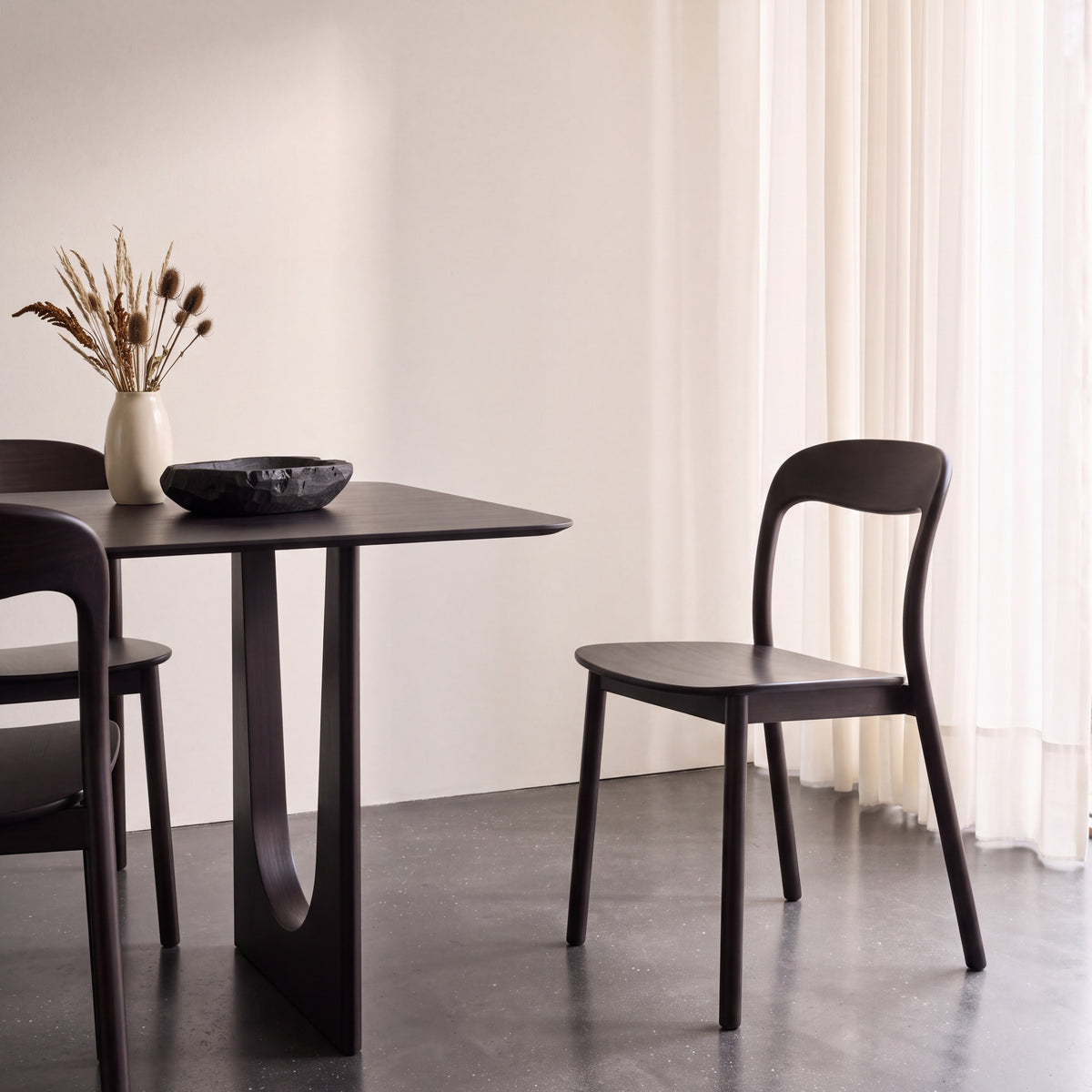 Greenington Hanna Dining Chair in Caviar bamboo, in a dining room setting
