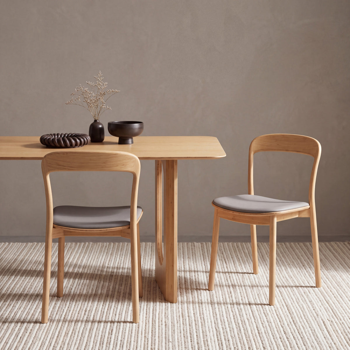Greenington Hanna Dining Chair Leather Seat in Wheat bamboo with a Grey leather seat, pictured in a dining room