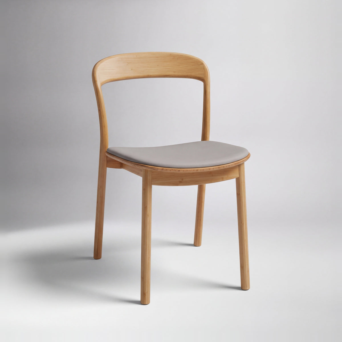 Greenington Hanna Dining Chair Leather Seat in Wheat bamboo with a Grey leather seat, on a studio background