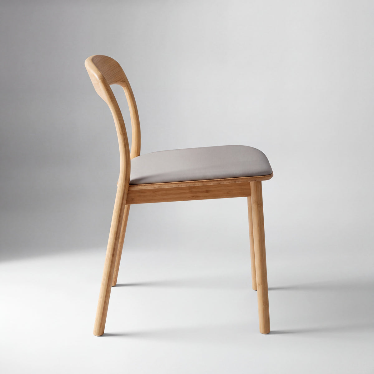 Greenington Hanna Dining Chair Leather Seat in Wheat bamboo with a Grey leather seat, shown on a plain background