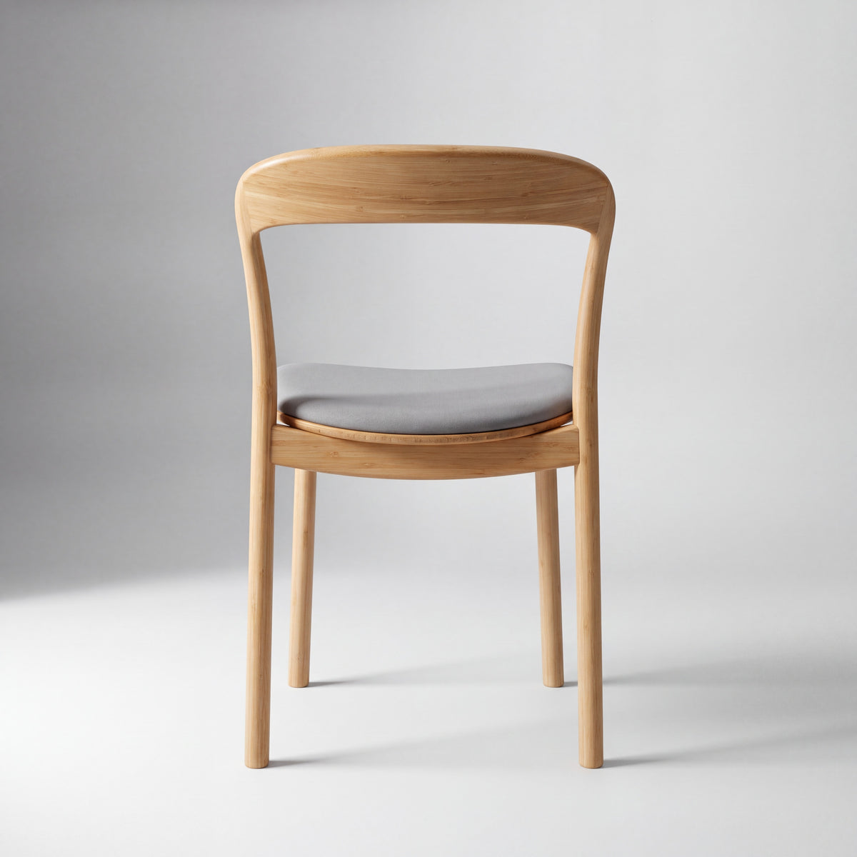 Greenington Hanna Dining Chair Leather Seat in Wheat bamboo with a Grey leather seat, studio photo on a plain background