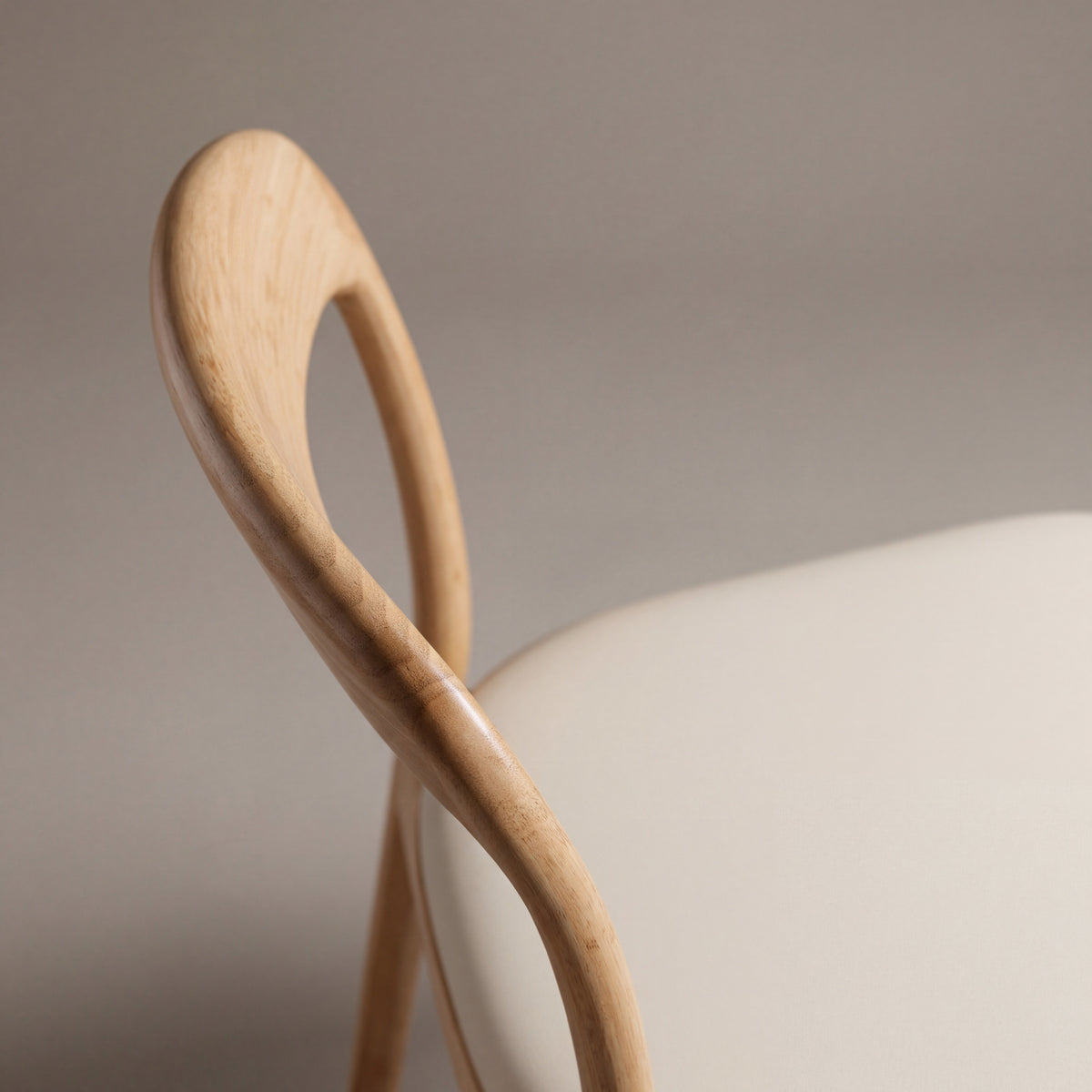 Close-up of the backrest on the Greenington Hanna Dining Chair Leather Seat in Wheat bamboo with a Grey leather seat