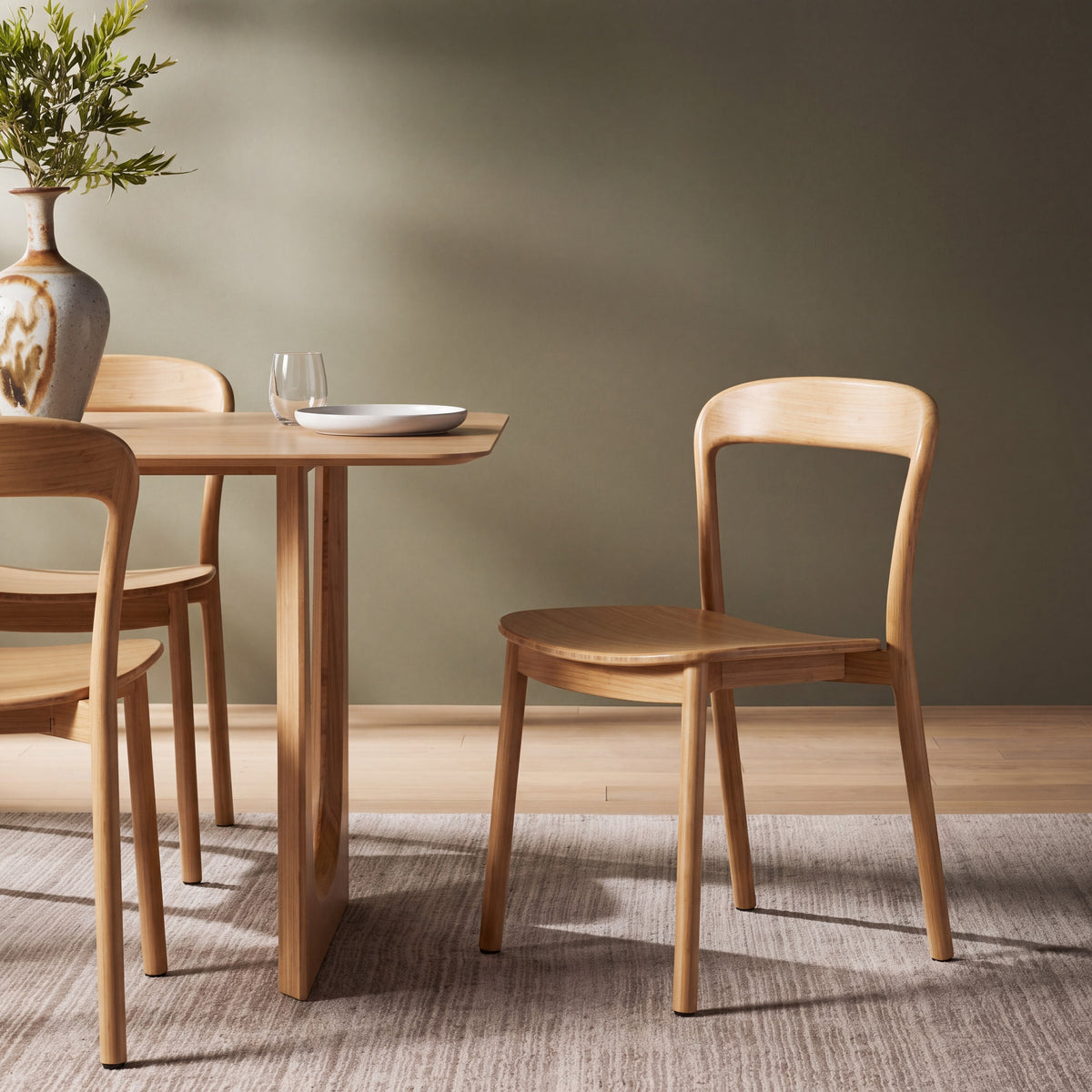 Greenington Hanna Dining Chair in Wheat bamboo, styled in a dining room
