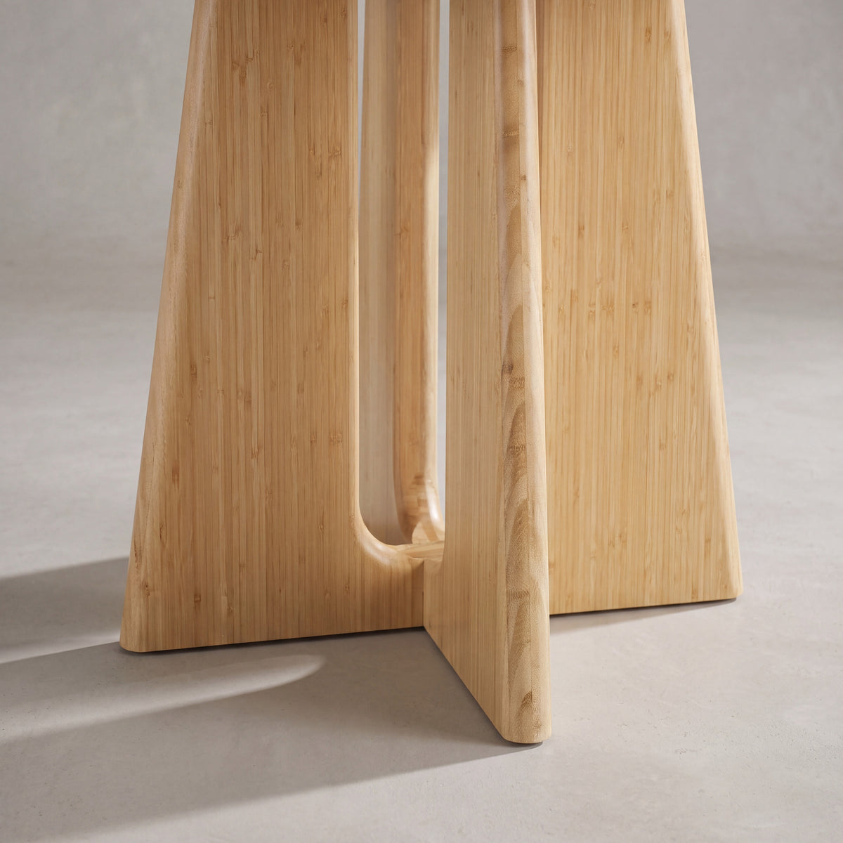 Close-up of the leg on the Greenington Luna Dining Table in Wheat bamboo