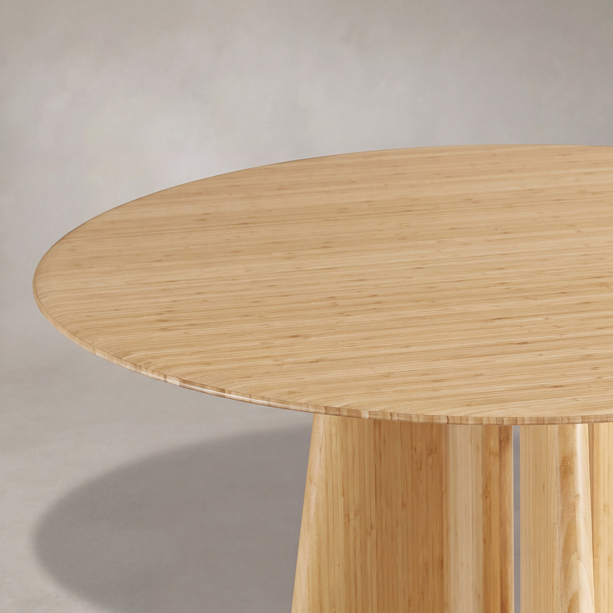 Close-up of the top and bamboo grain on the Greenington Luna Dining Table in Wheat bamboo