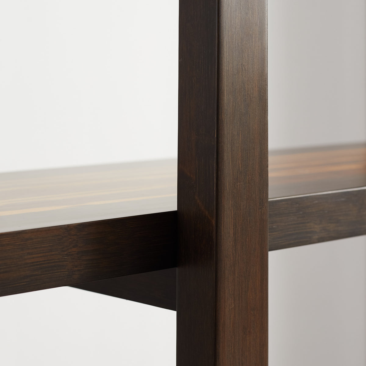 Detail of the frame on the Greenington Magnolia Shelf in Black Walnut bamboo