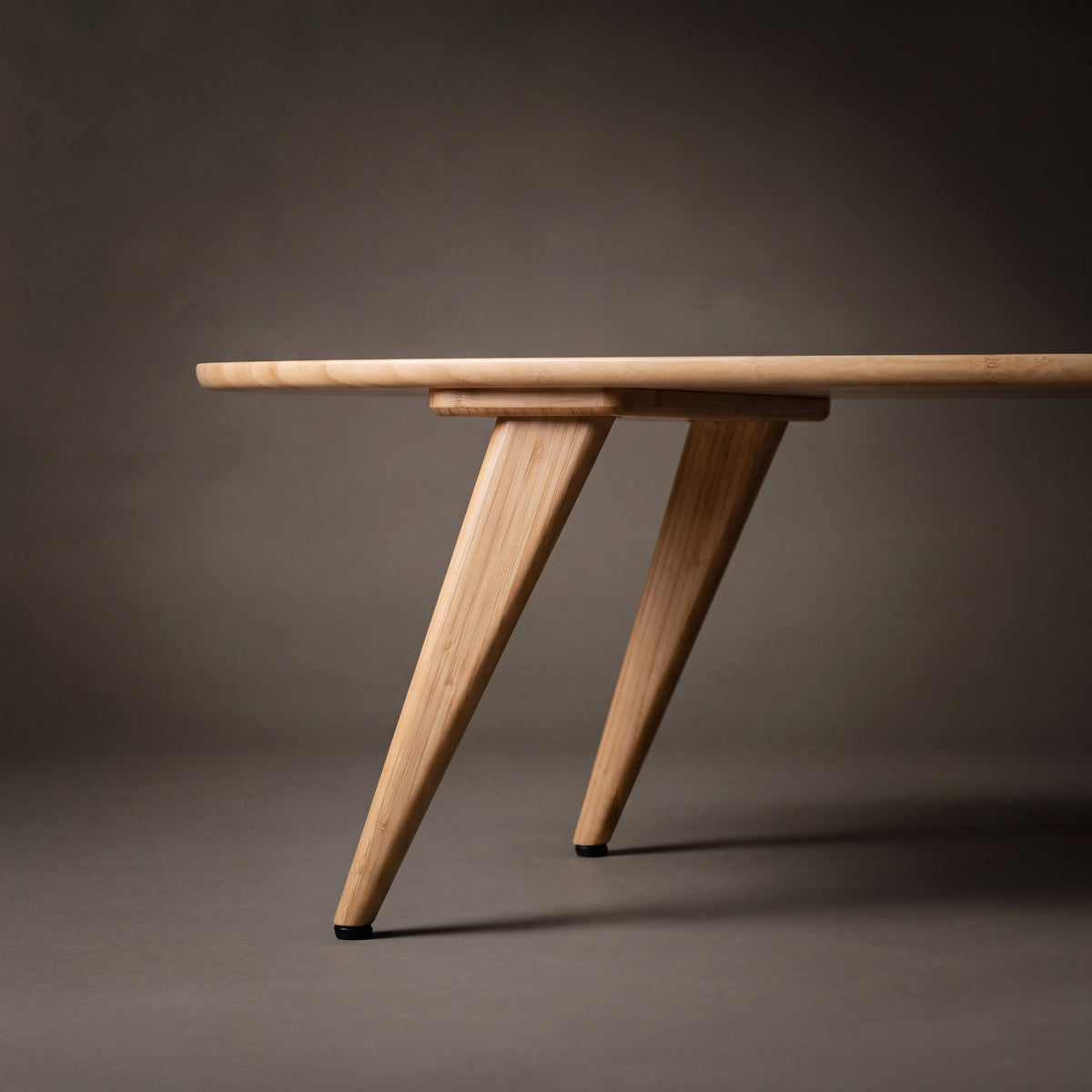 Close-up of the leg on the Greenington Malibu Coffee Table in Caramelized bamboo