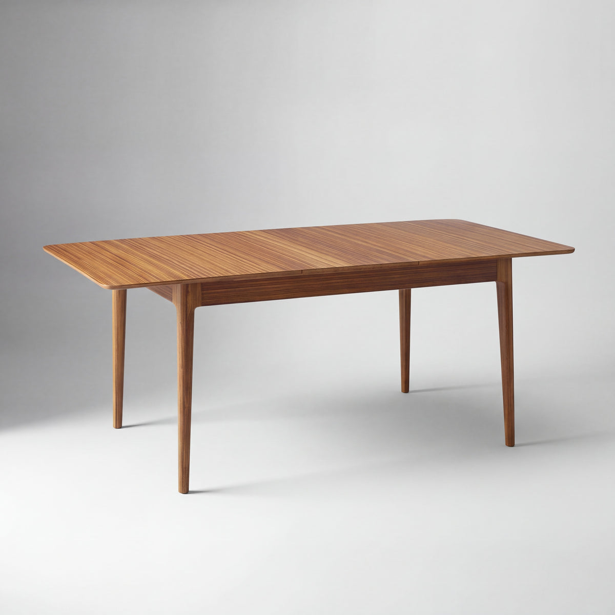 Greenington Mija Dining Table in Amber bamboo, shown on a plain background