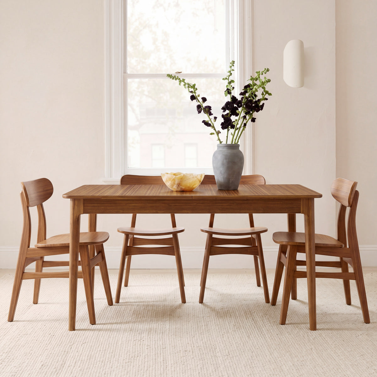 Greenington Mija Dining Table in Amber bamboo, in a dining room setting