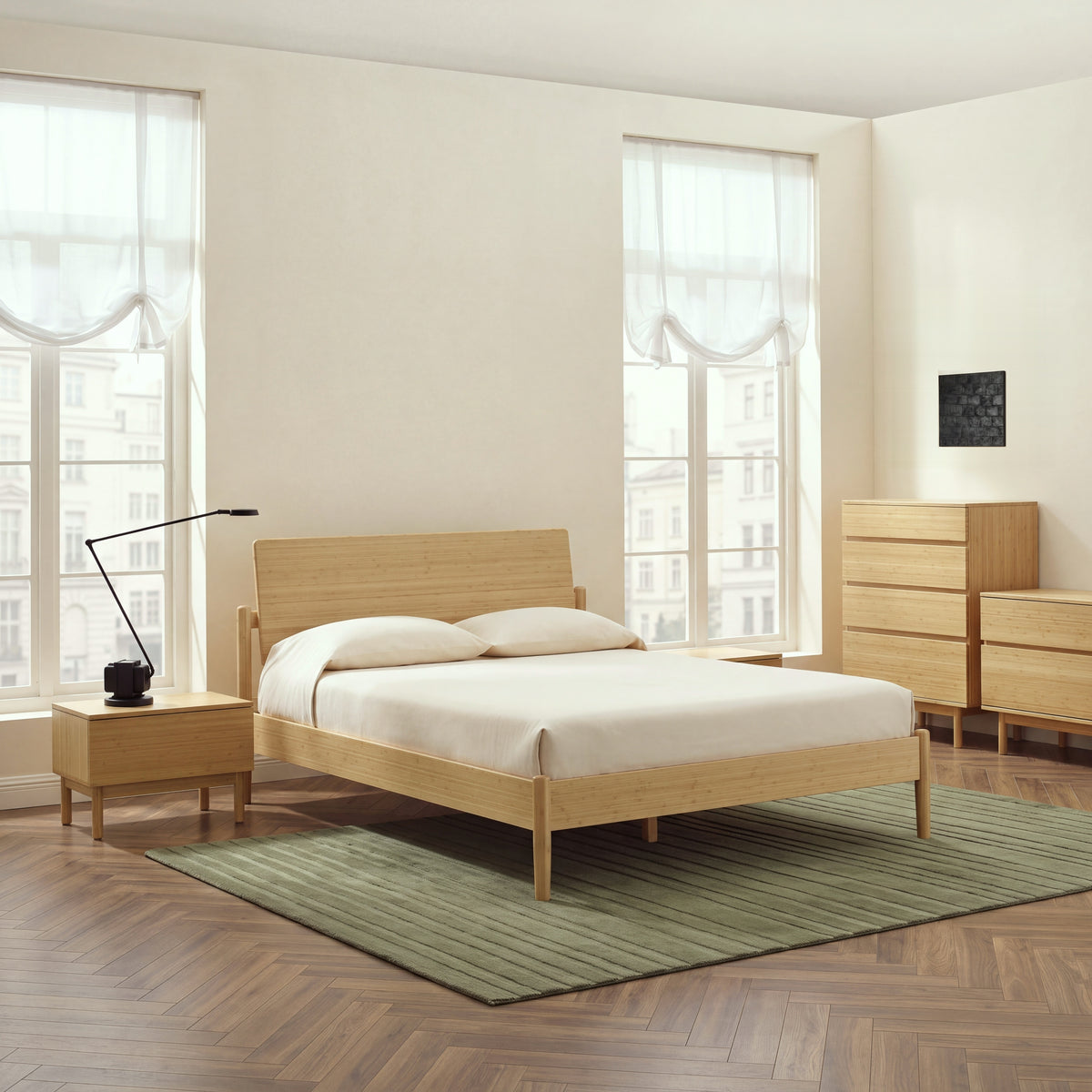 Monterey Platform Bed in Wheat bamboo with nightstand, chest and dresser in a cream room with a moss-green striped rug