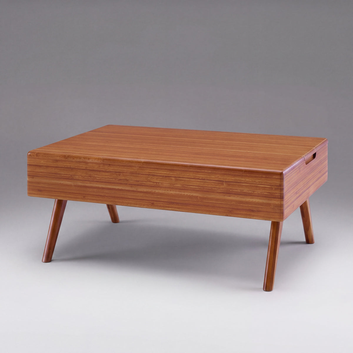 Greenington Rhody Lift Top Coffee Table in Amber bamboo, on a studio background